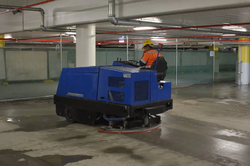 Sweeping a new concrete slab