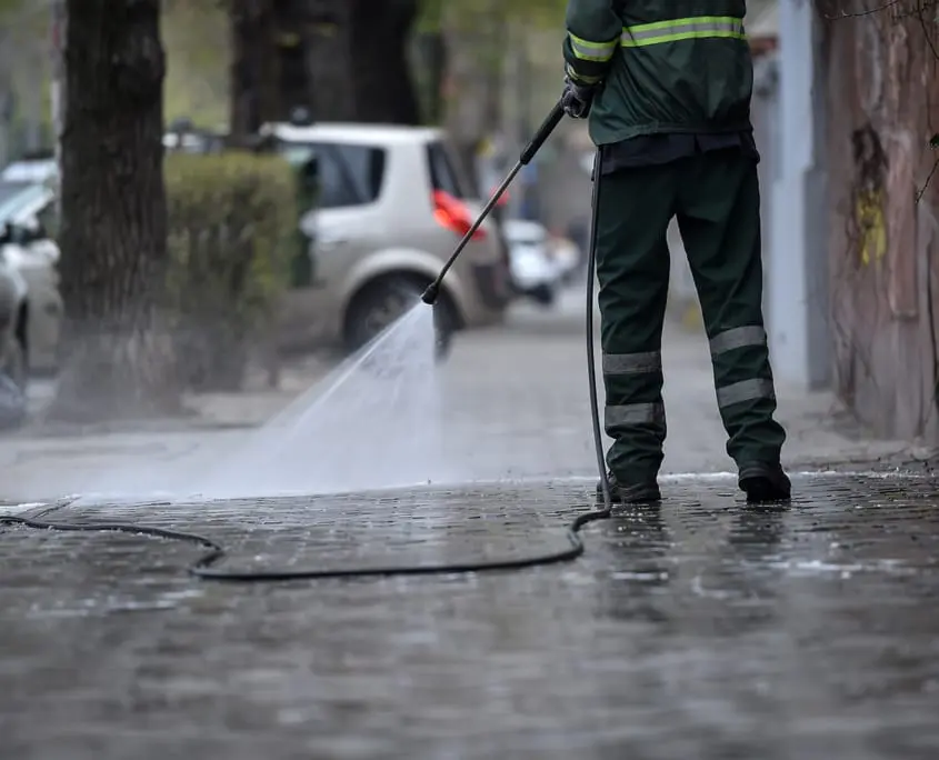 Pressure cleaning roads and footpaths