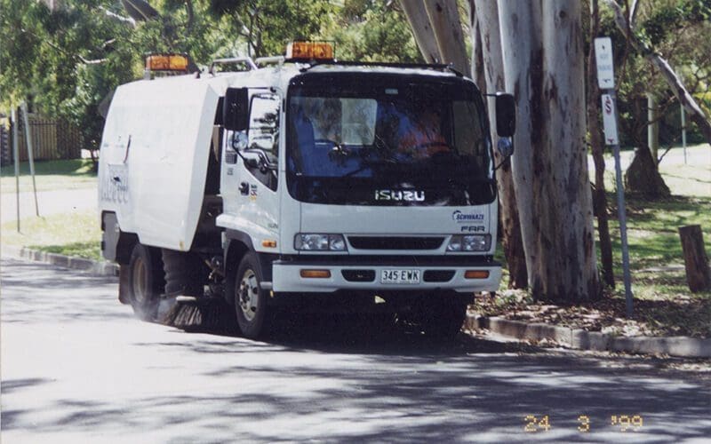 Road Sweeper Sweeping Leafs - Street Sweeping Services